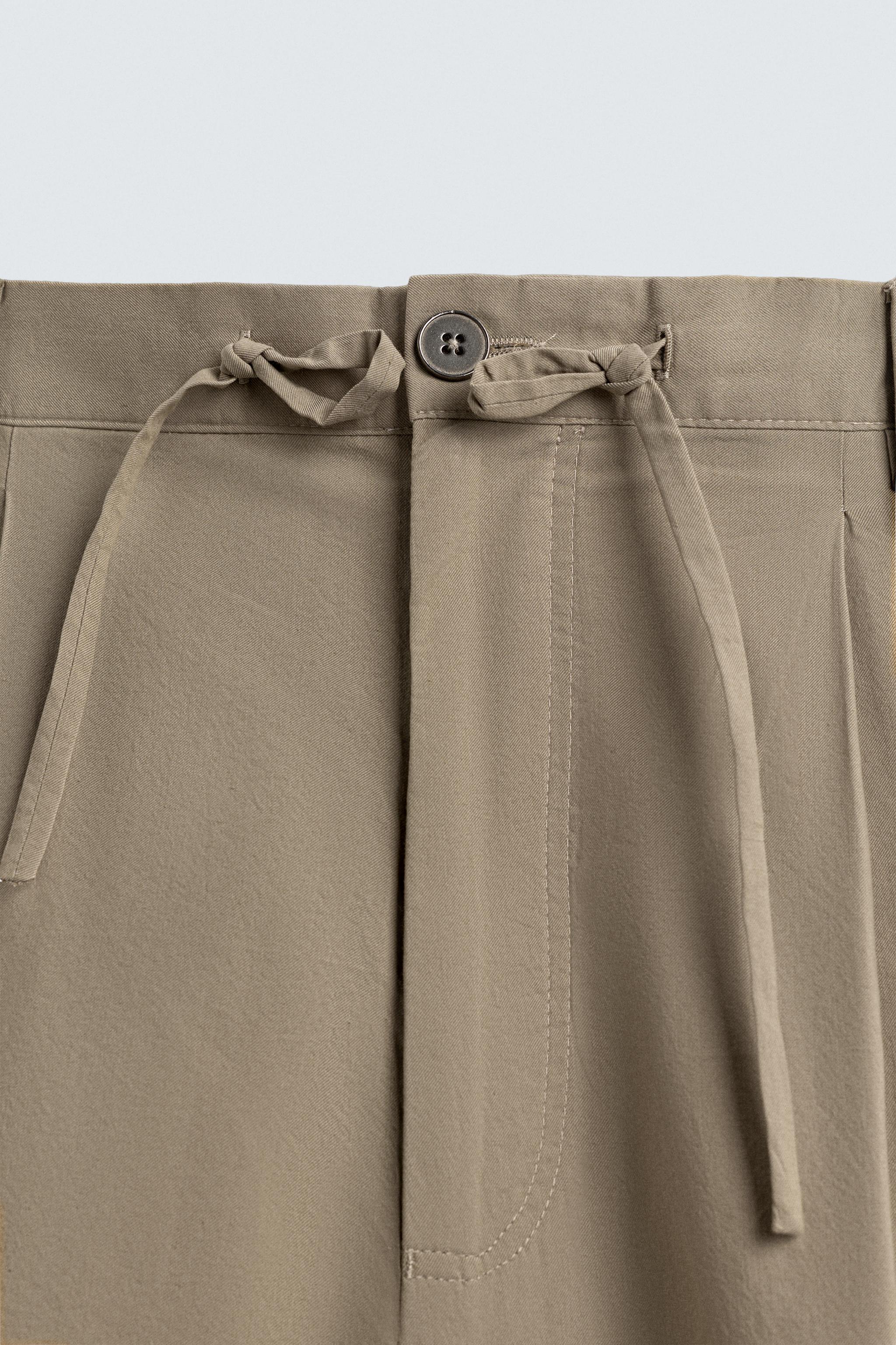 BALLOON FIT PLEATED PANTS